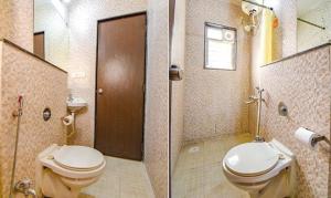 a bathroom with a toilet and a shower and a sink at FabHotel Sky Vista Inn in Pune
