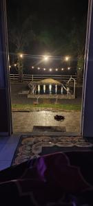 a view of a bench in a park at night at Teniat Village in Rantau Panjang
