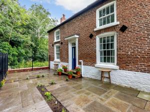 a brick house with a patio in front of it at 1 Bed in Chester 78587 in Chester