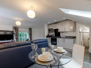 a kitchen and living room with a table and chairs at 1 Bed in Chester 78587 in Chester