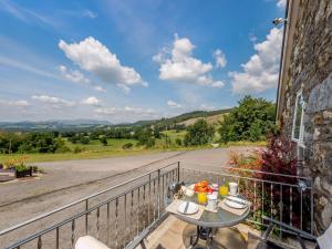 a balcony with a table and a view of a road at 1 bed property in Bala North Wales 83765 in Llandderfel