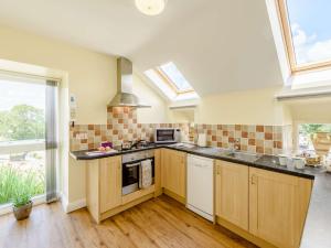 a kitchen with a sink and a stove at 1 bed property in Bala North Wales 83765 in Llandderfel