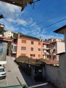 a view of an apartment building from a street at 22 La Maisonette in Karpenisi