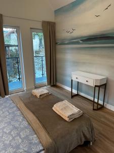 Łóżko lub łóżka w pokoju w obiekcie Apartamenty Piasek i Słońce