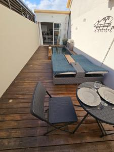 Balkón nebo terasa v ubytování Tiny Badamier Blanc appartement 4 étoiles 2 à 4 personnes piscinelle chauffée