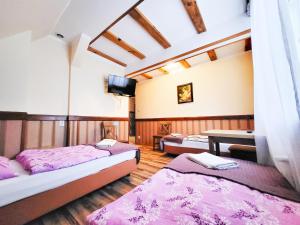 Postel nebo postele na pokoji v ubytování Pensjonat Li-Mar