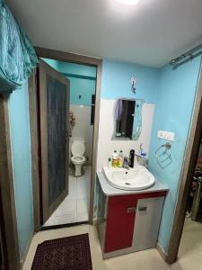 a bathroom with a sink and a toilet at Avena 2BHK Fully Furnished Flat Mid Of City Siliguri in Siliguri