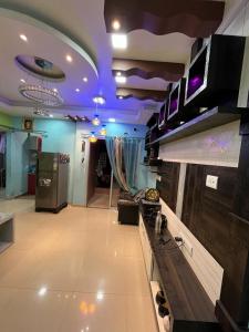a living room with purple lights on the ceiling at Avena 2BHK Fully Furnished Flat Mid Of City Siliguri in Siliguri
