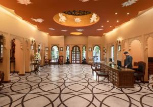 a man standing in the lobby of a building at jüSTa Rajputana Resort & Convention Centre, Udaipur in Udaipur