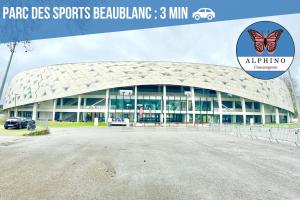 a large building with a butterfly on the facade at Le Sportif, spacieux et moderne in Limoges