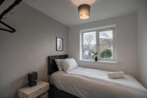 Postel nebo postele na pokoji v ubytování Brecon Gardens