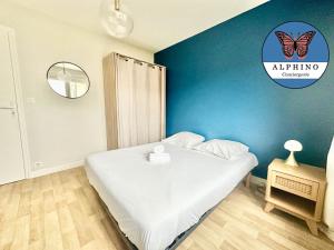 Ein Bett oder Betten in einem Zimmer der Unterkunft Le Sportif, spacieux et moderne
