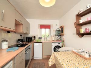 a kitchen with a table and a counter top at 1 bed property in Langwathby Cumbria SZ113 in Langwathby