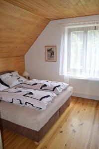 Łóżko lub łóżka w pokoju w obiekcie Apartmány Český Ráj