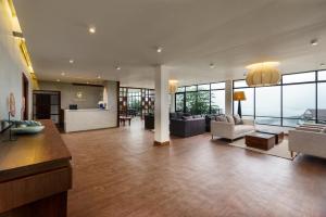 a large living room with a couch and chairs at Grand Beragala Boutique Resort in Beragala