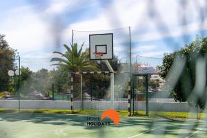 a basketball hoop on a tennis court at #048 Sea and City view with Pool, AC in Brejos