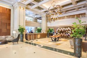 a lobby of a hotel with a chandelier at InterContinental Santiago, an IHG Hotel in Santiago