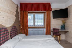 Postel nebo postele na pokoji v ubytování Hotel Franco