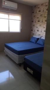 Ένα ή περισσότερα κρεβάτια σε δωμάτιο στο Flat Getsêmani Olímpia a 10min do Thermas dos Laranjais +26 φωτογραφίες