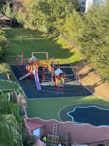 an aerial view of a playground in a park at Sea & mountain view penthouse in Estepona