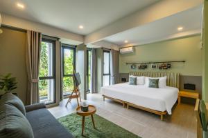 Postel nebo postele na pokoji v ubytování Chamemon Bed Phuket Town