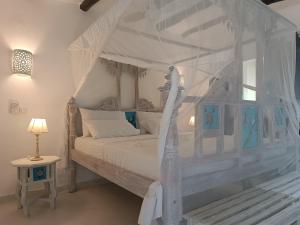 Postel nebo postele na pokoji v ubytování Pole Pole Beach House + 37 fotografií