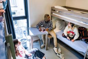 Postel nebo postele na pokoji v ubytování De Ploate Hostel
