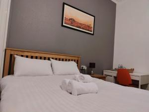 Postel nebo postele na pokoji v ubytování Aaran Central Guesthouse