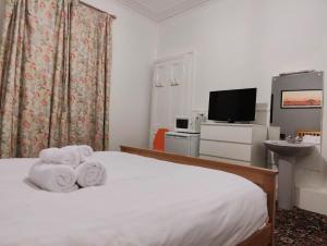 Postel nebo postele na pokoji v ubytování Aaran Central Guesthouse