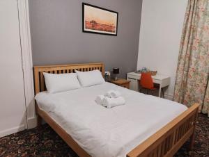 Postel nebo postele na pokoji v ubytování Aaran Central Guesthouse