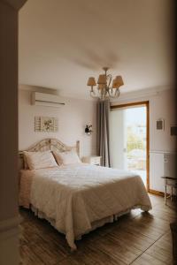 Ένα ή περισσότερα κρεβάτια σε δωμάτιο στο Pousada Paty´s Garden