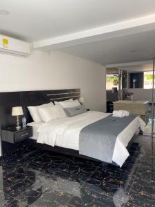 Voodi või voodid majutusasutuse Malokas Resort - Socorro - San Gil toas
