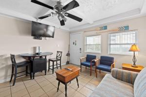 a living room with a couch and a table at Comfy 1BR By the Beach with Pool and Parking 12 in Myrtle Beach