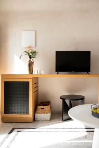 TV o dispositivi per l'intrattenimento presso Andromeda Villas & Spa Resort