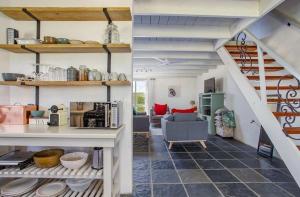 a living room with a staircase and a living room at Littlevlei Selfcatering in Wellington