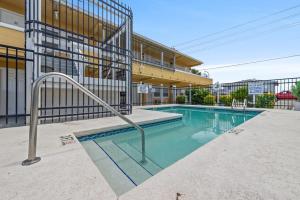 a swimming pool in front of a building at Comfy 1BR By the Beach with Pool and Parking 12 in Myrtle Beach