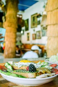 a plate of food sitting on a table at Happy Home Dream Surf in Imsouane