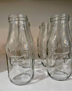 three empty glass jars sitting on a table at Cozy 1BR with Patio in the Heart of Albany in Albany