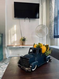 a toy truck with fruit in the back on a table at Cozy 1BR with Patio in the Heart of Albany in Albany