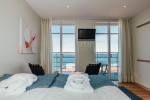 Postel nebo postele na pokoji v ubytování Gullmarsstrand Hotell & Konferens + 37 fotografií