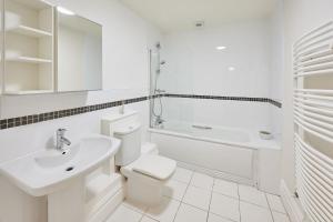 a white bathroom with a toilet and a sink at Host & Stay - The Ivanhoe Retreat in Liverpool