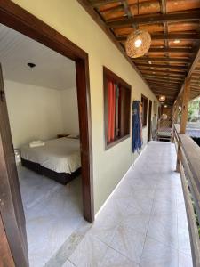 Cama ou camas em um quarto em Eco Pousada Mentawai