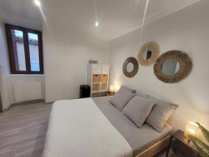 Postel nebo postele na pokoji v ubytování Le Provençal