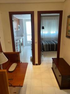 a room with a kitchen and a living room at Apartamento en Benicassim. in Benicàssim