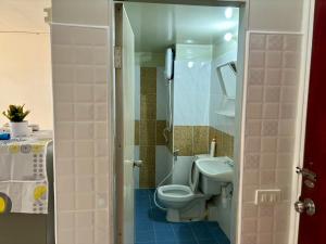 a small bathroom with a toilet and a sink at Room For rent poppular condo T8 Fl 6 in Thung Si Kan