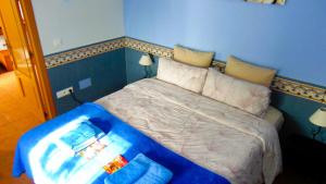 Postel nebo postele na pokoji v ubytování Casa La Vida Feliz