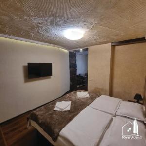 Voodi või voodid majutusasutuse River House Boutique Hotel toas