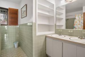 a bathroom with two sinks and a mirror at Fripp Island 702 Tautog in Fripp Island +42 photos