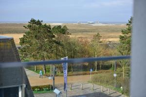 a view of a soccer field from a window at Parkhotel Residenz in Sankt Peter-Ording
