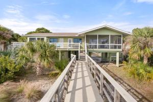 a house on the beach with a wooden boardwalk at Fripp Island 702 Tautog in Fripp Island